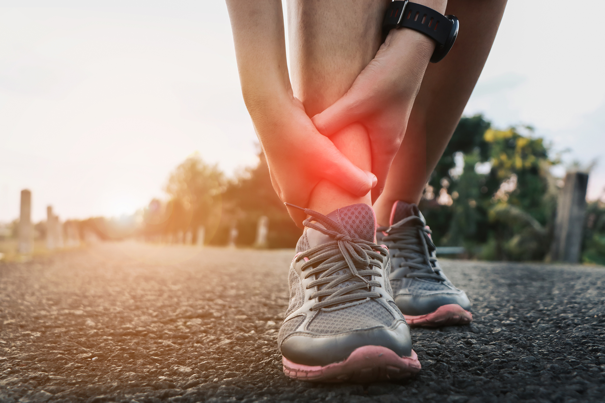 Ankle twist sprain accident in sport exercise running jogging.sprain or cramp Overtrained injured person when training exercising or running outdoors.